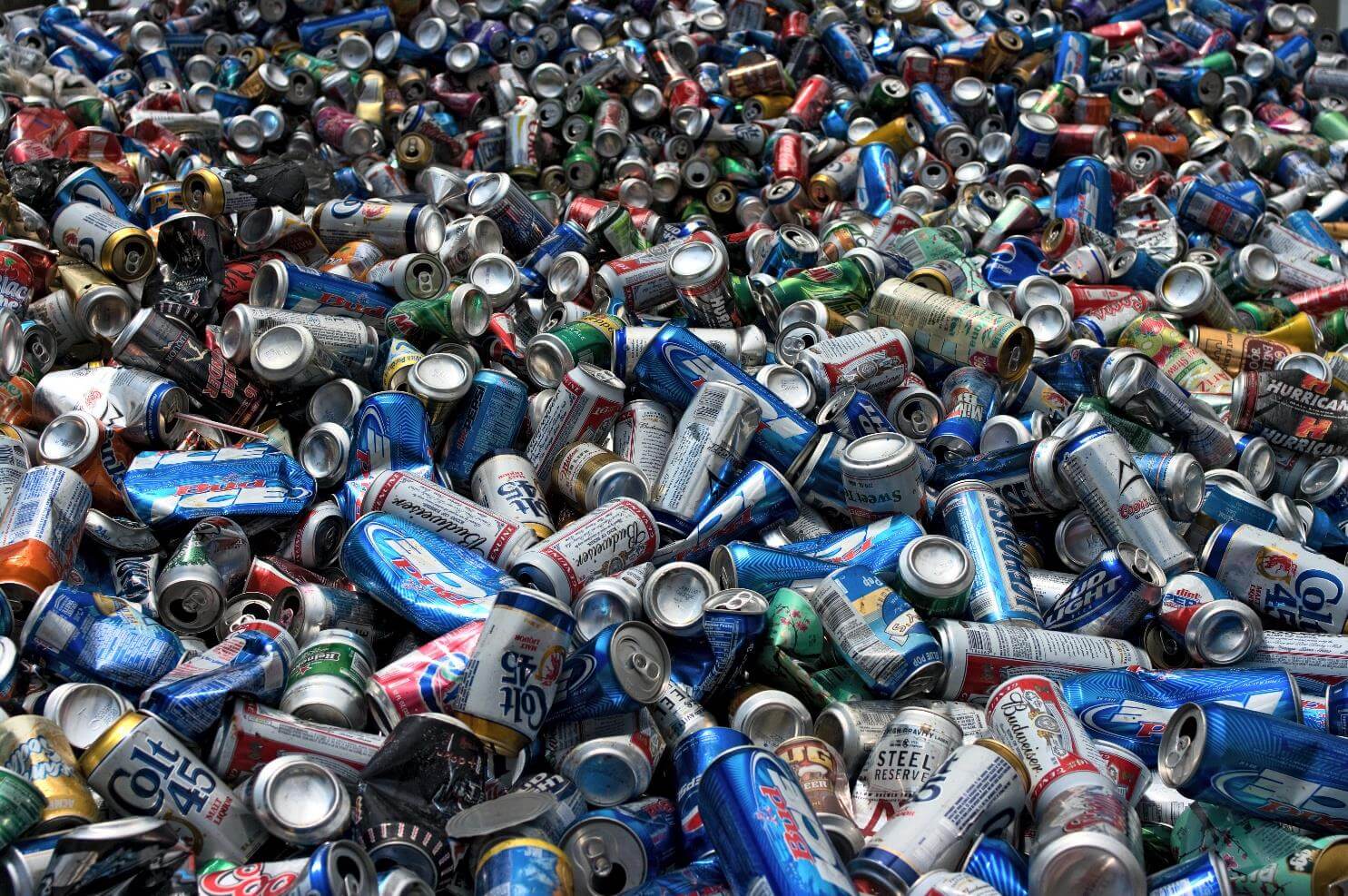 Pile of crushed metal beverage cans.