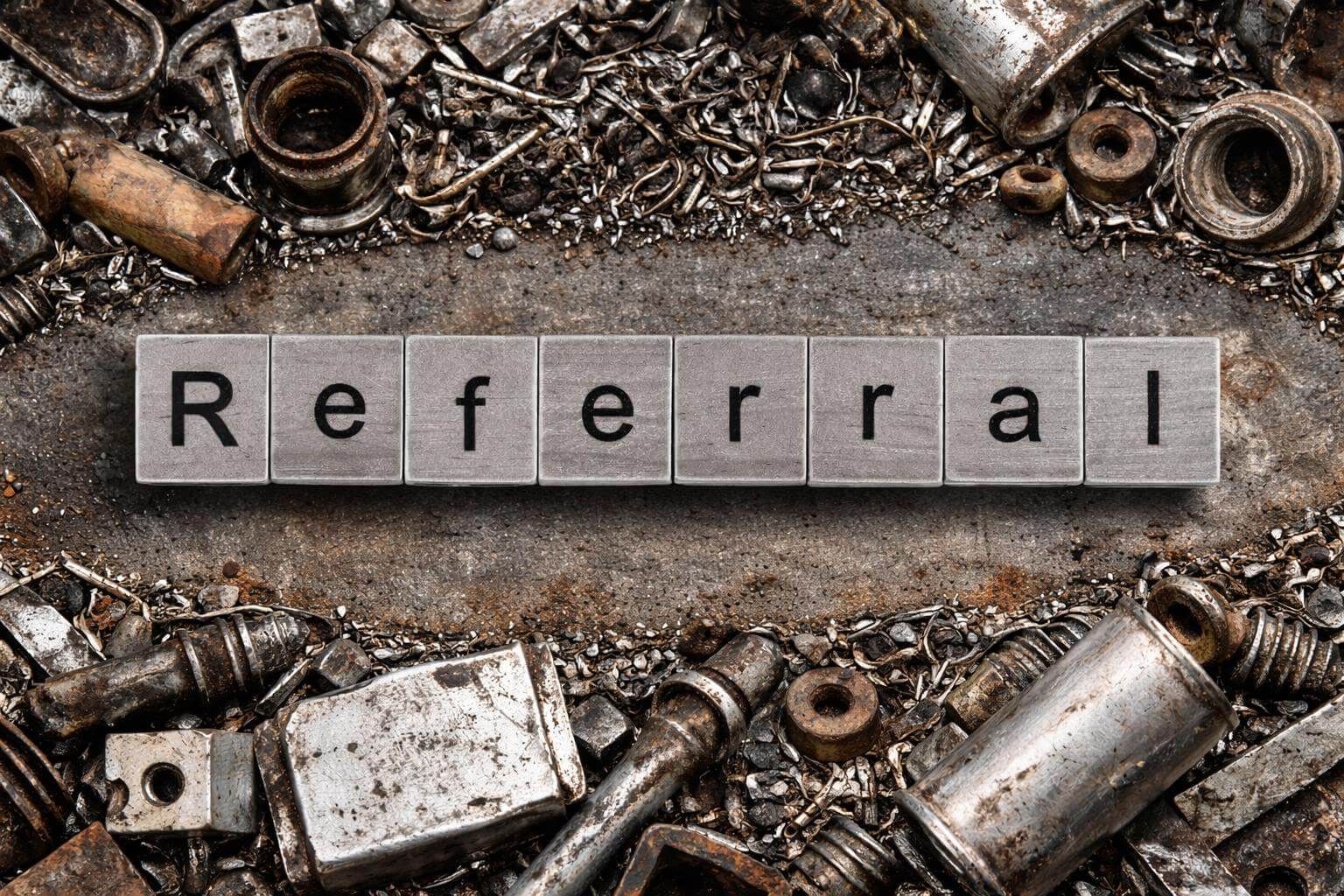 Referral tiles surrounded by metal scraps.